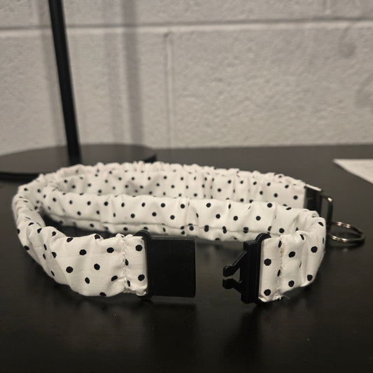 White with black polka dots