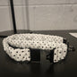 White with black polka dots