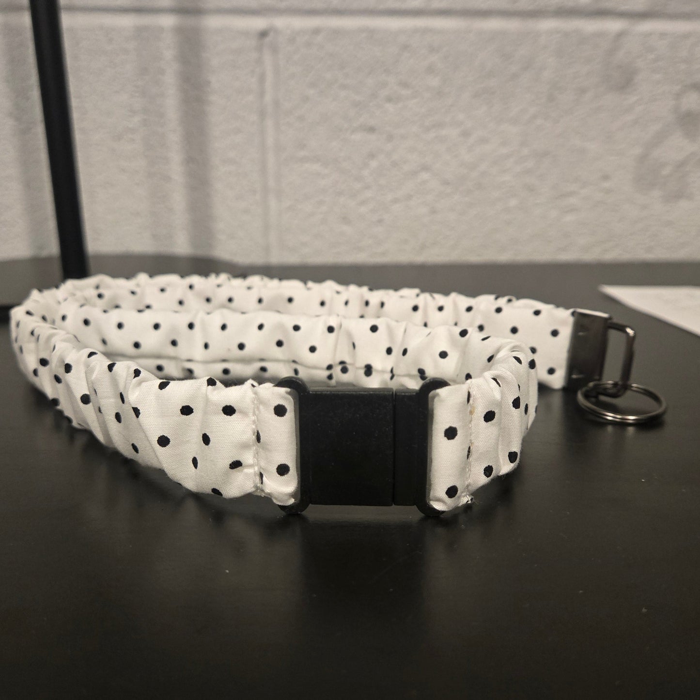 White with black polka dots