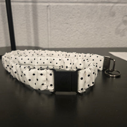 White with black polka dots